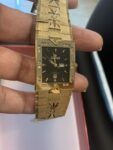 Men’s Sunborn square face gold tone diamond accent Black dial watch