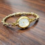 Avon Womens Oval gold Tone Amethyst Stones Quartz Analog Watch